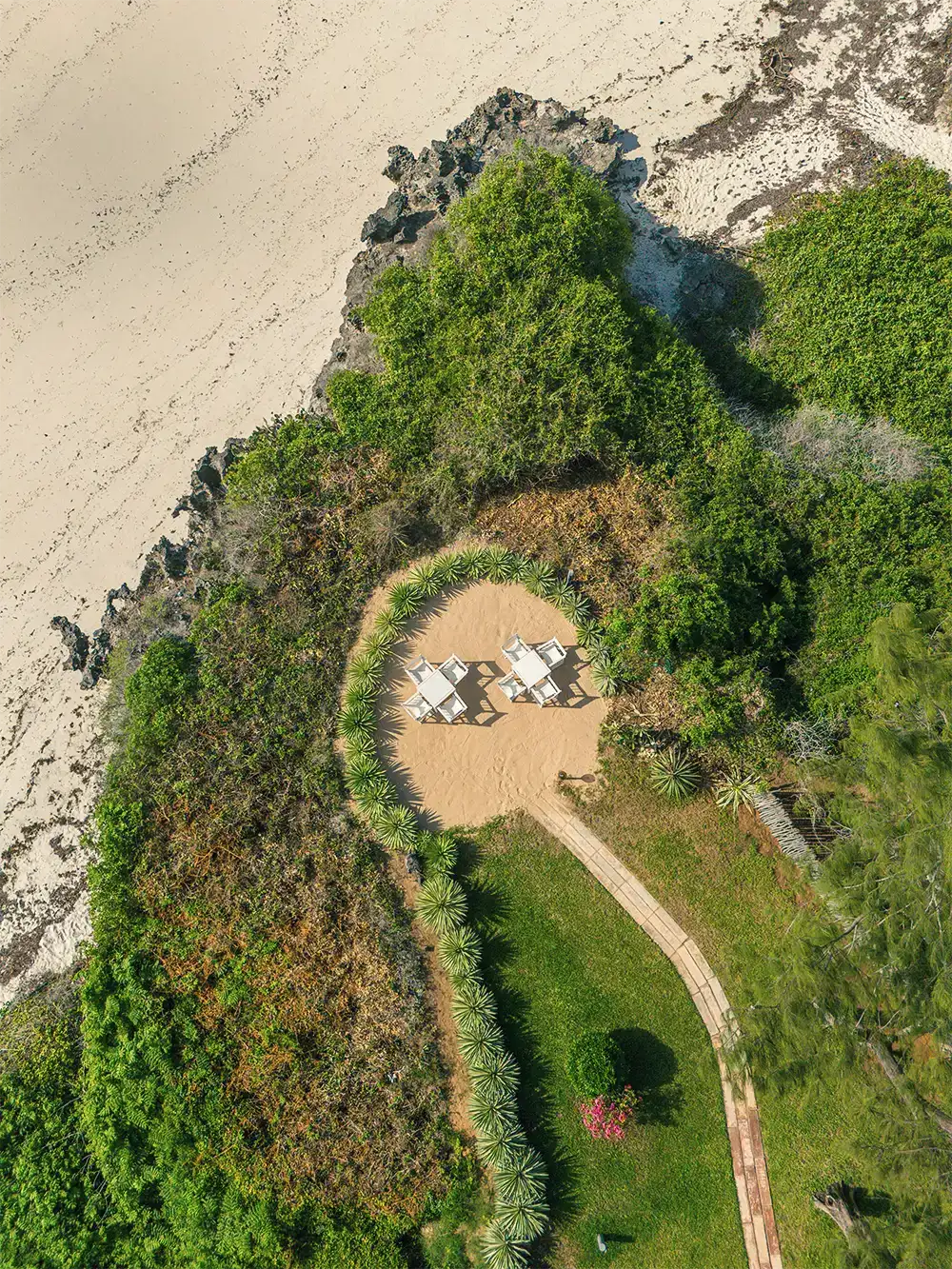 Aerial view of Kobe View Point dining area surrounded by tropical vegetation and beach