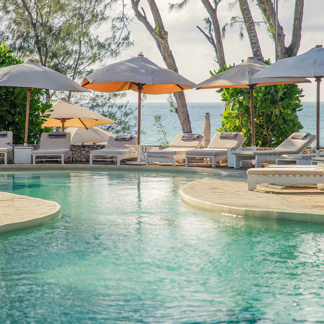 Ocean View Pool with sun loungers overlooking the Indian Ocean at Kobe Suite Resort