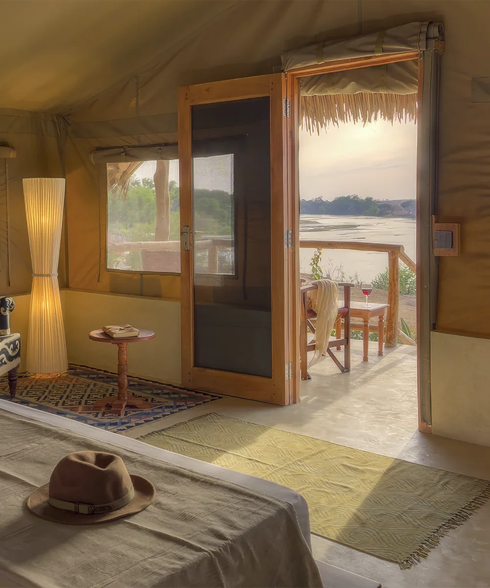 Luxury safari tent overlooking the landscape of Tsavo East National Park in Kenya