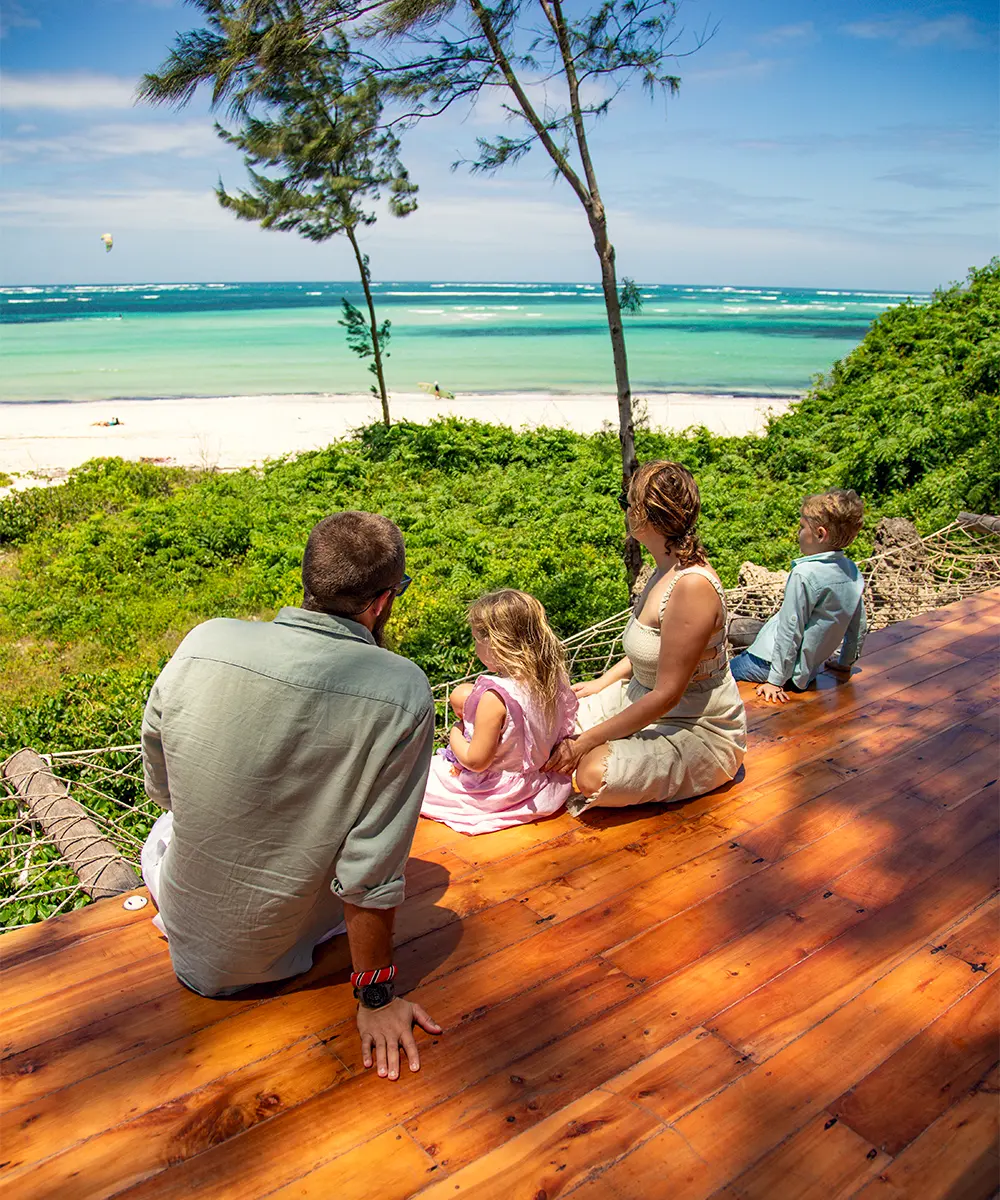 Family enjoying a tropical beach view at Kobe Suite Resort in Watamu, Kenya