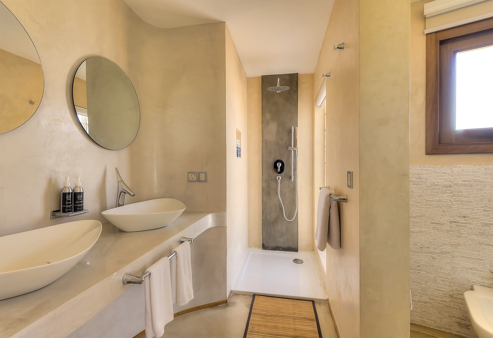 Presidential Ocean View Suite bathroom with double vessel sinks and walk-in shower