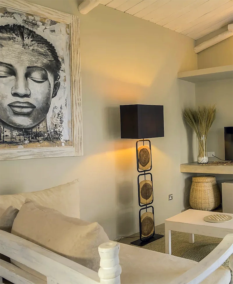 Deluxe Ocean View Suite living area with African-inspired decor and seating