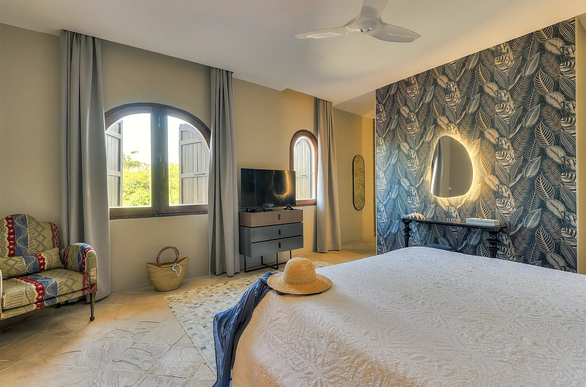 Presidential Ocean View Suite bedroom with king-size bed and African-inspired decor