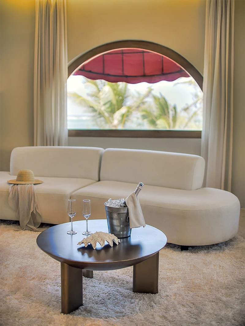 Presidential Ocean View Suite living area with ocean views and champagne setting