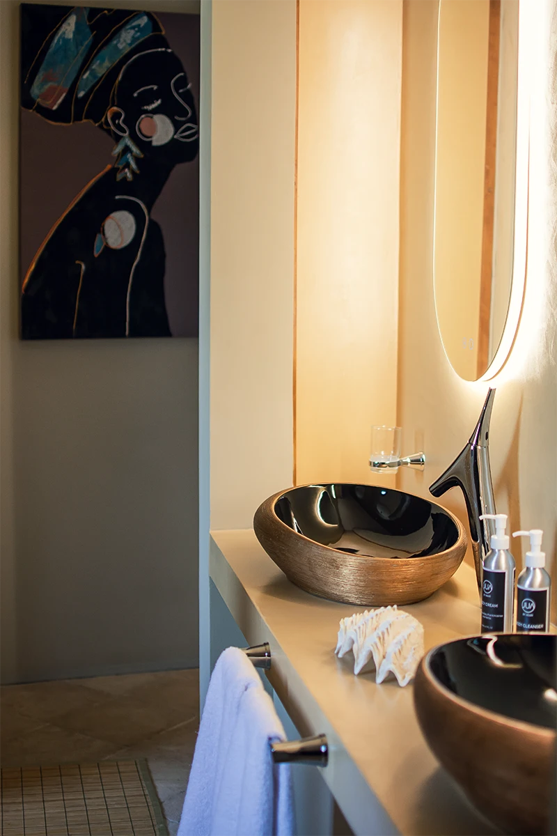 Presidential Ocean View Suite bathroom with vessel sinks and illuminated mirror