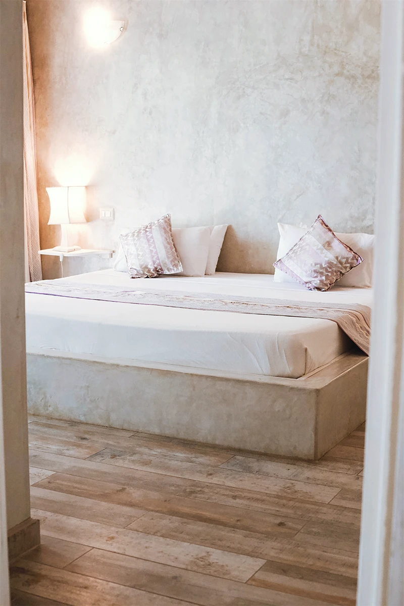 Deluxe Garden View Suite bedroom with king-size bed and elegant interior