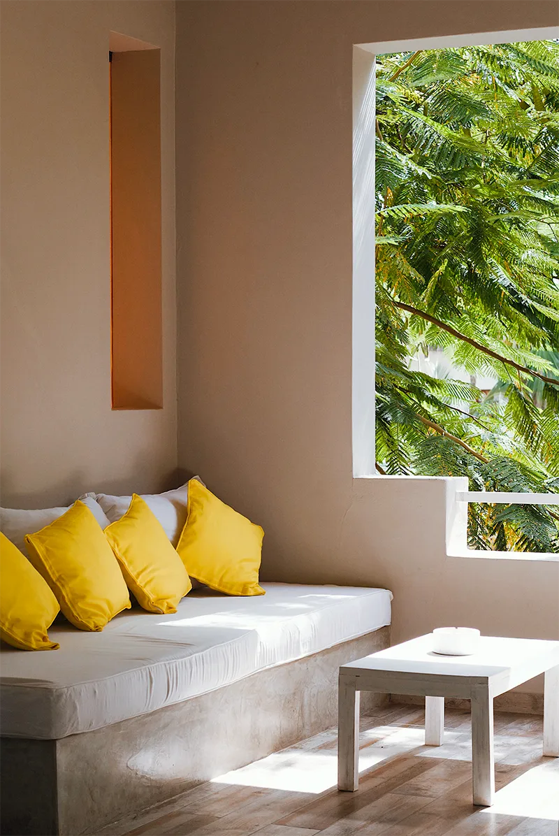 Deluxe Garden View Suite seating area with a tropical garden view