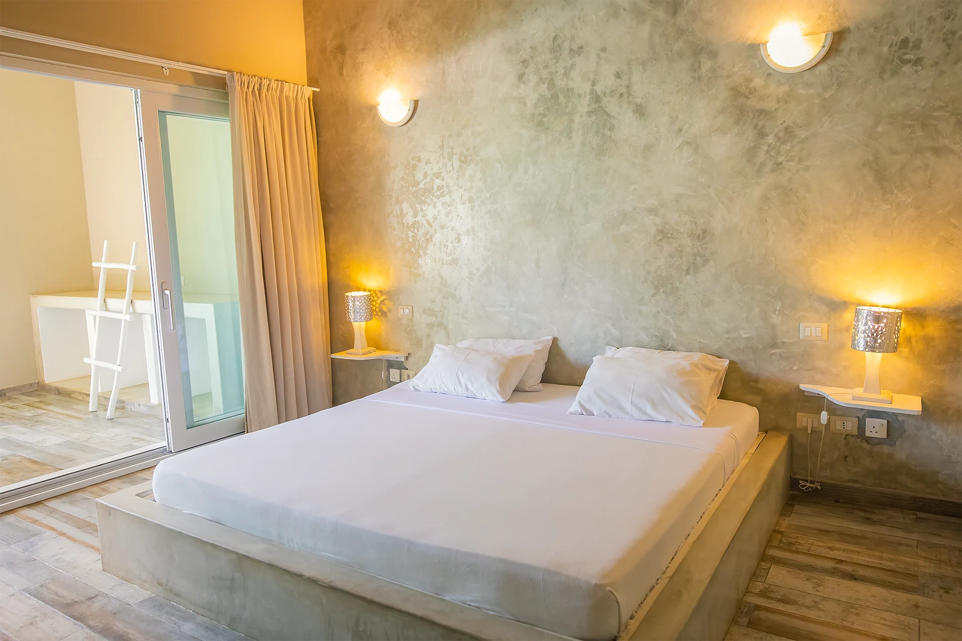 Deluxe Garden View Suite bedroom with king-size bed and elegant interior