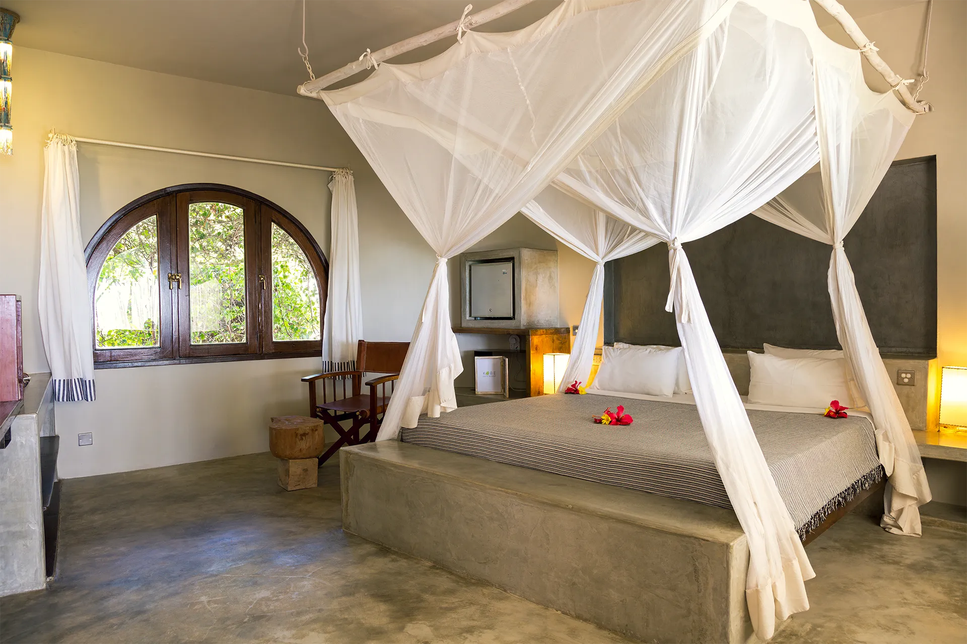 Ocean View Suite bedroom with king-size bed and African-inspired decor