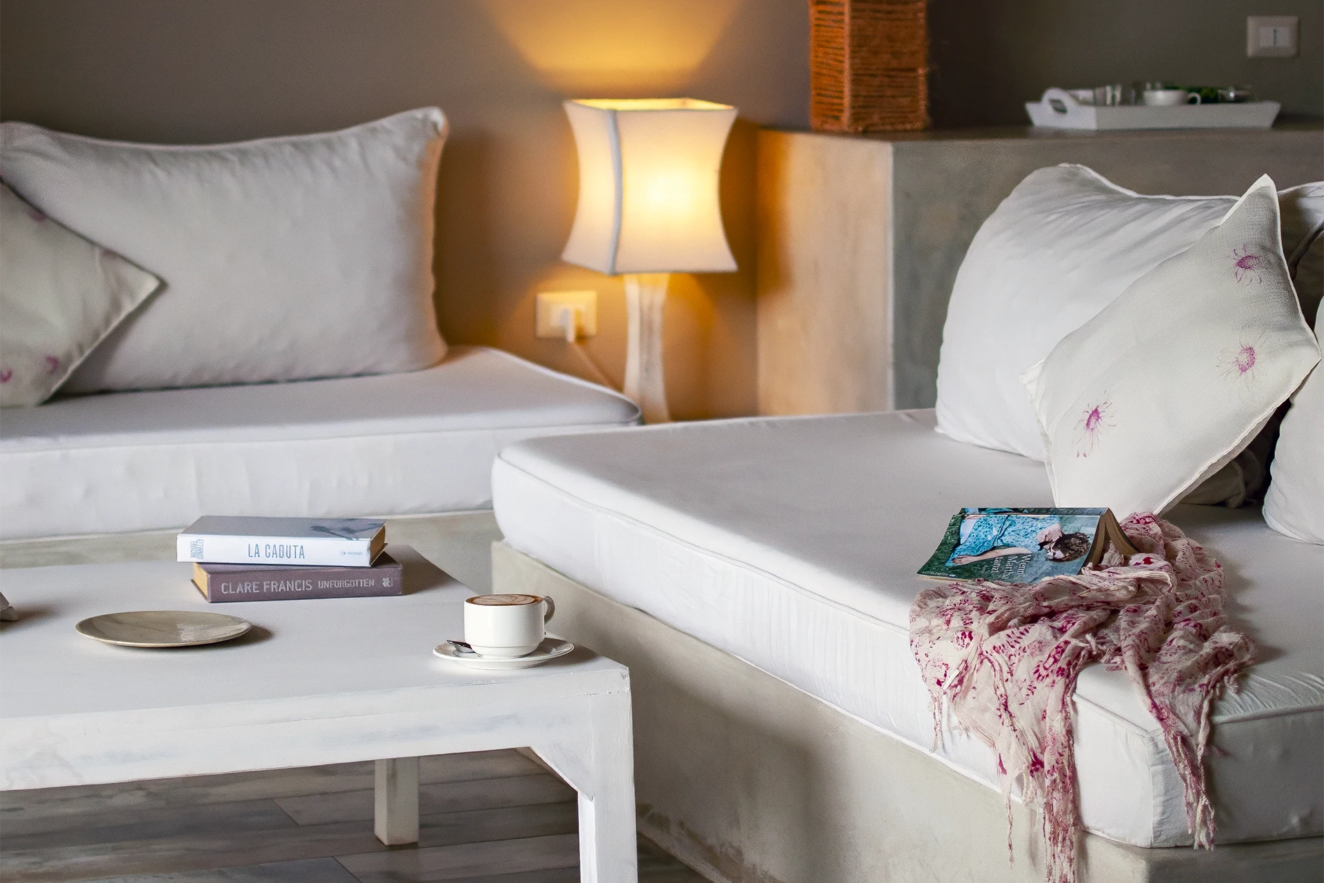 Comfortable seating area with coffee table inside the Standard Garden View Suite