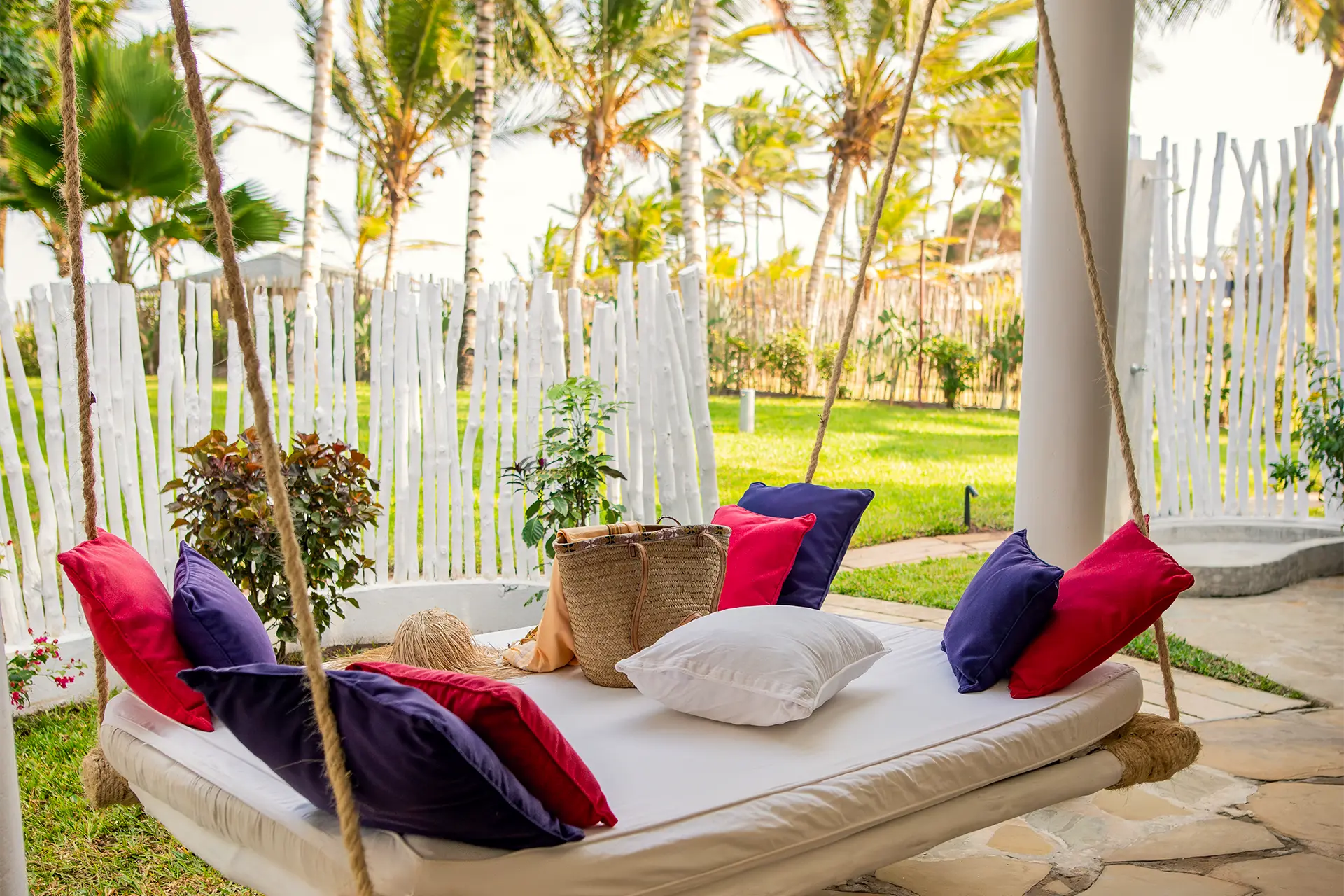 Hanging daybed in the tropical garden outside the Ocean View Suite