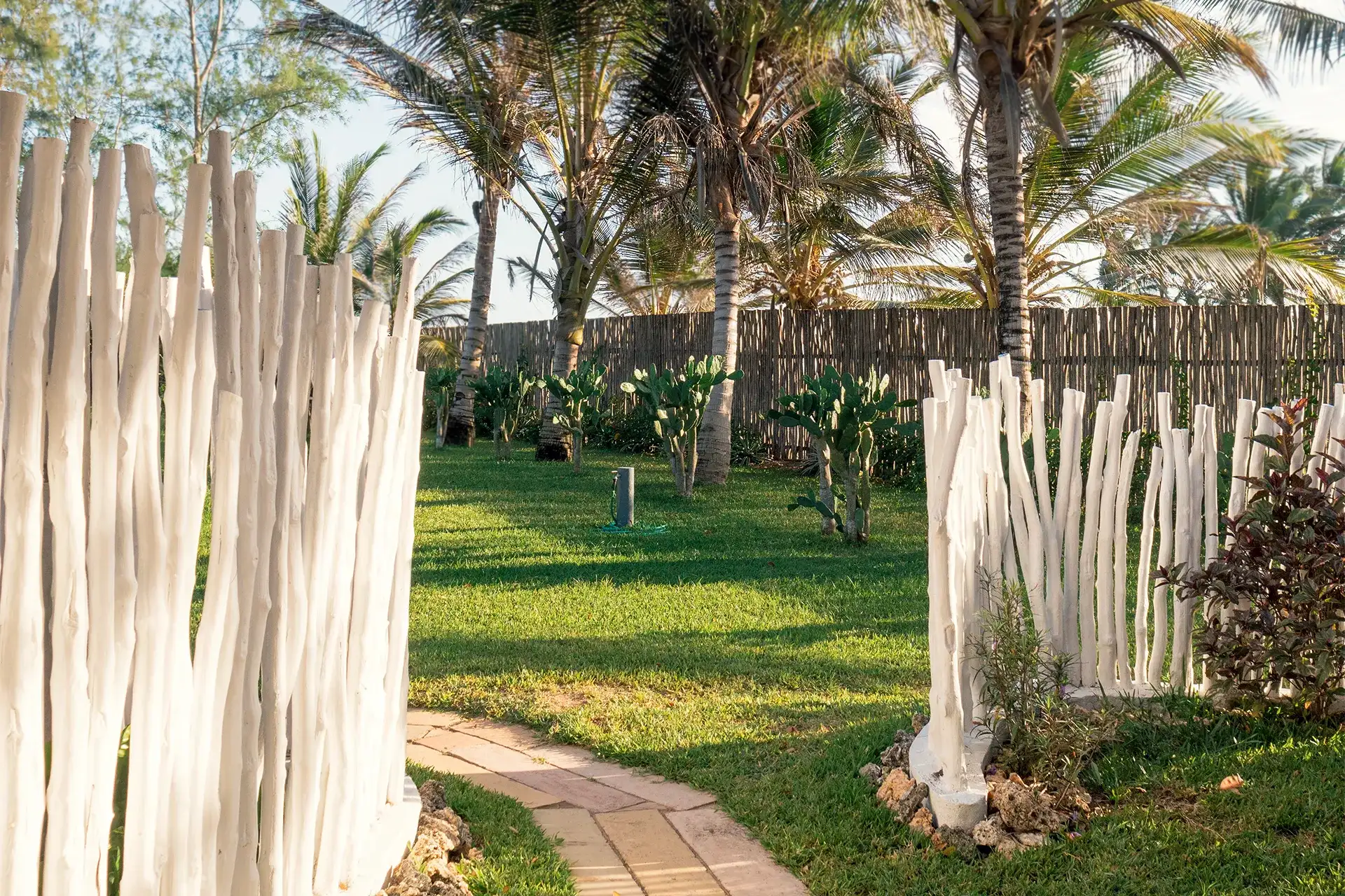 Garden pathway surrounded by tropical plants at the Ocean View Suite