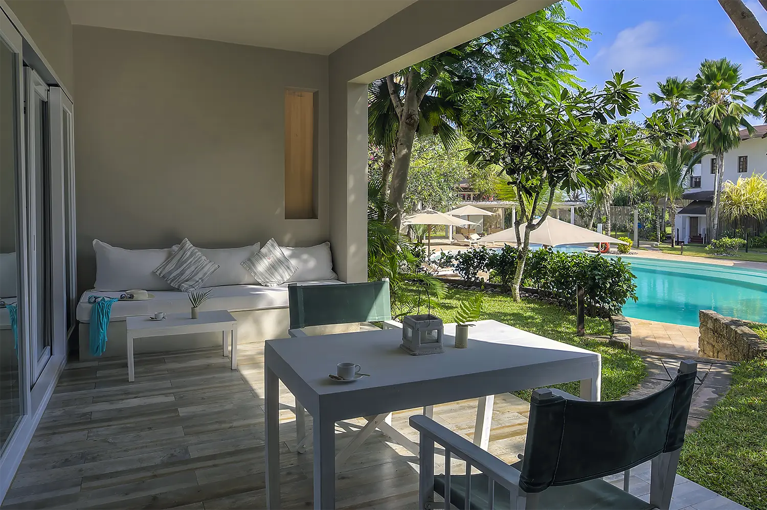 Deluxe Garden View Suite with private terrace overlooking the tropical gardens and pool