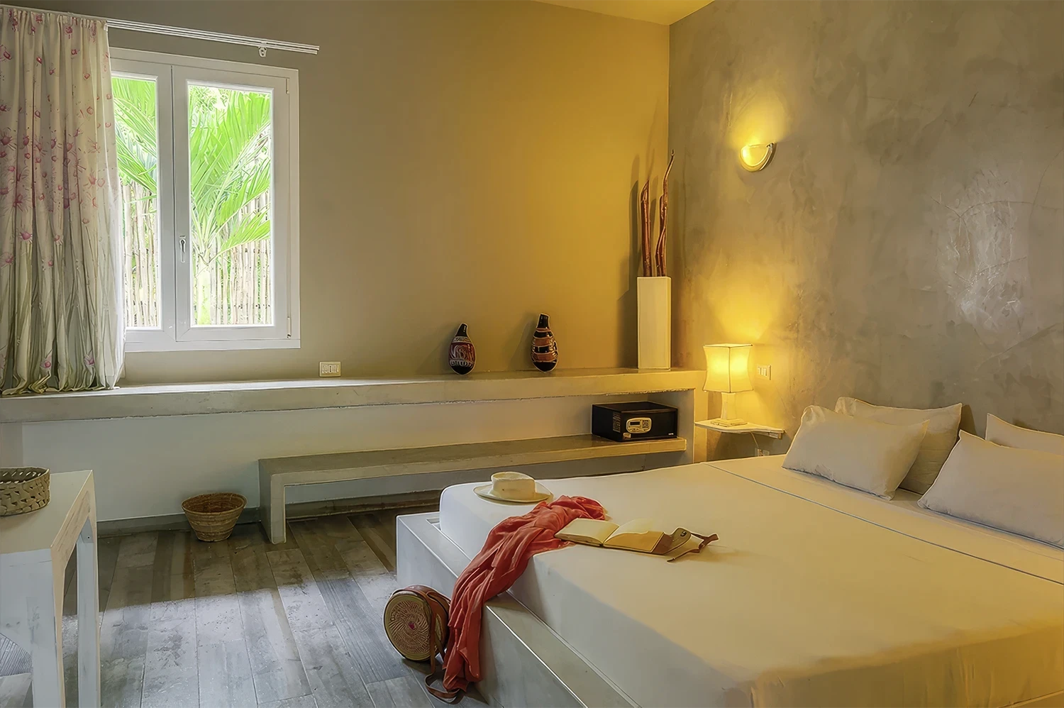 Standard Garden View Suite bedroom with king-size bed and African-inspired decor