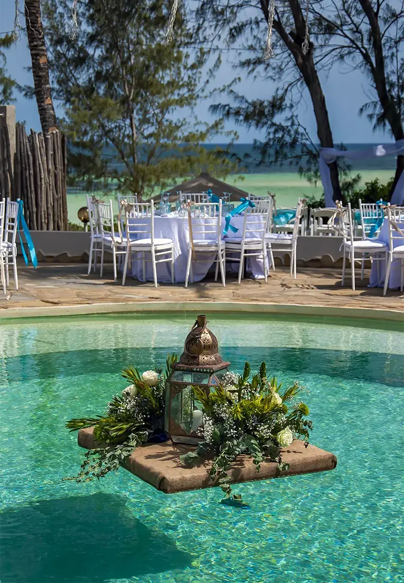 Wedding reception by the pool overlooking the Indian Ocean at Kobe Suite Resort