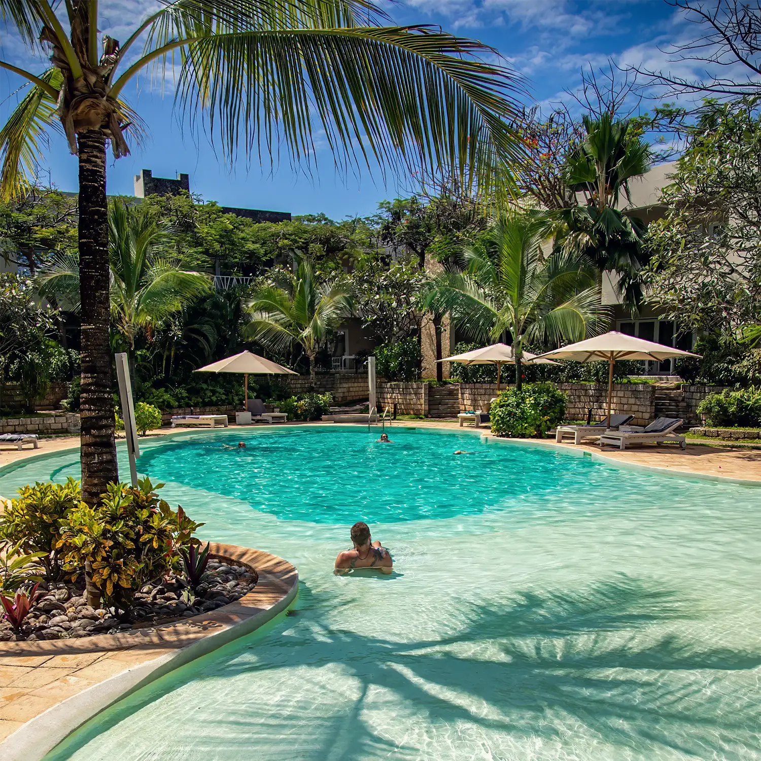 Garden Pool surrounded by lush tropical gardens at Kobe Suite Resort